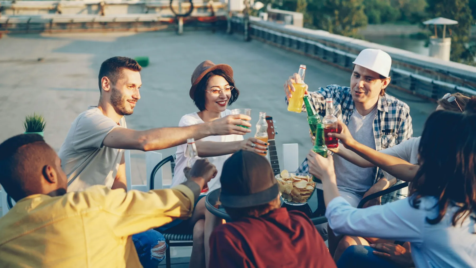 A mixed group of friends spending time together on a rooftop